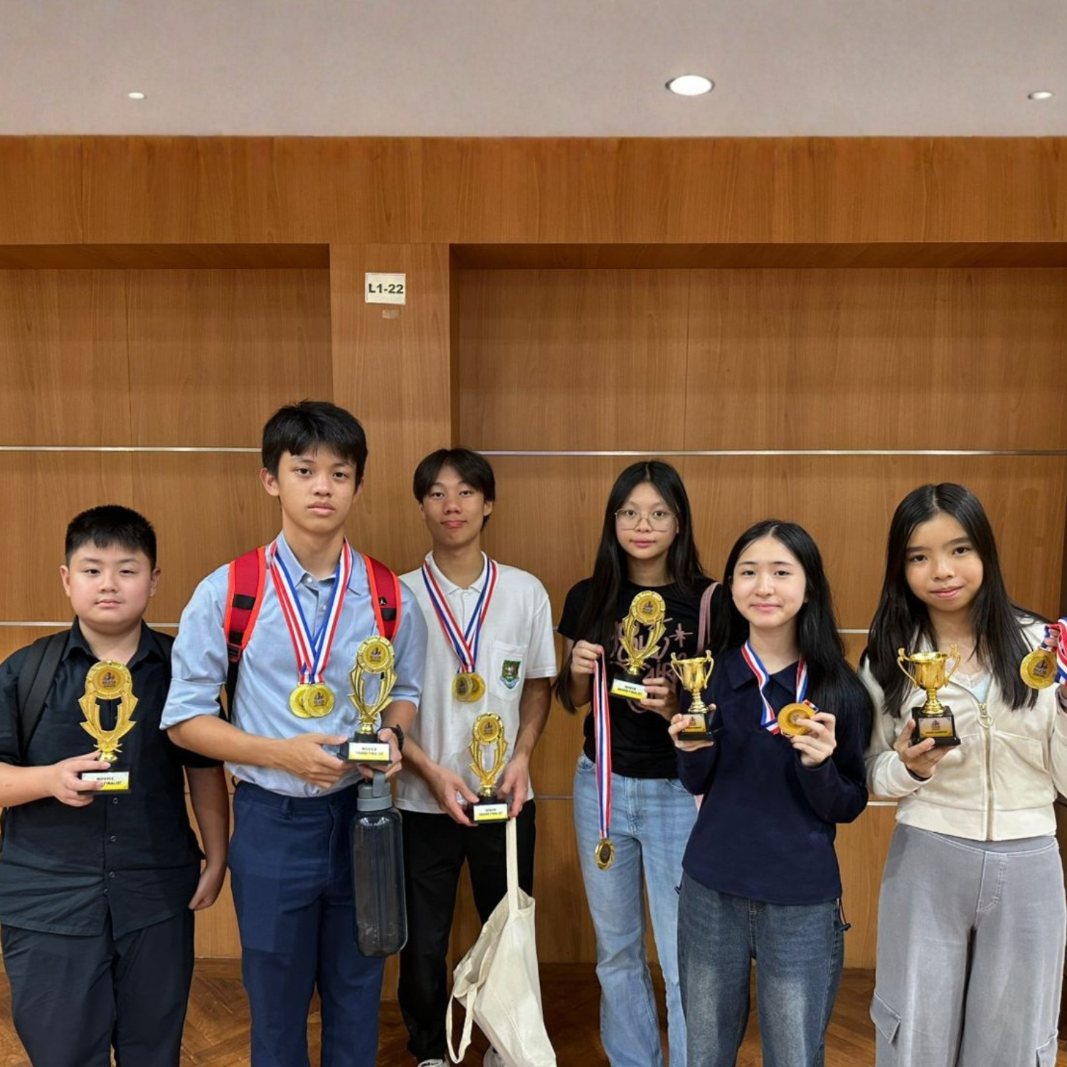 Apex Thought students with trophies