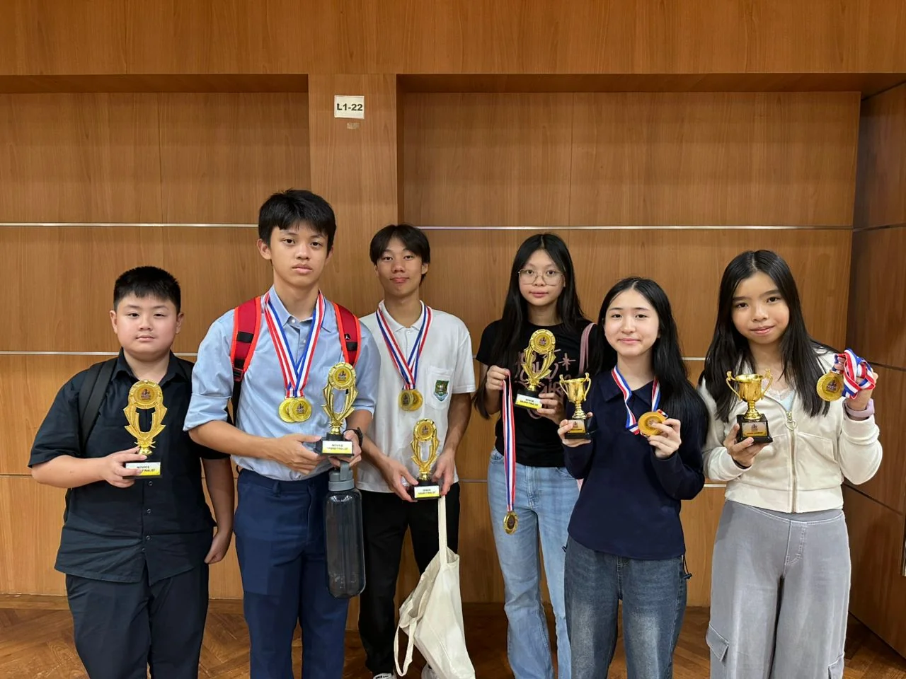 Apex Thought students with trophies